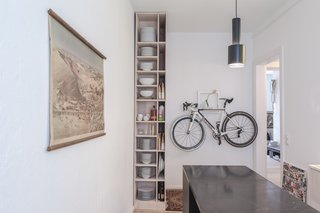 Freunde von Freunden and Vitra’s Berlin Apartment - Photo 6 of 9 - Kitchen of the Freunde von Freunden X Vitra ApartmentArchitect Etienne Descloux adjusted the original bathroom design to provide more space for storage in the kitchen. Bike by Mikili, flowers by Marsano.Photo by Steve Herud