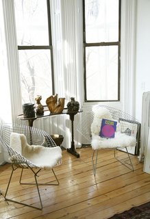 Sheepskin rugs are one of the most popular ways to offset the severity of Bertoia's wire chairs. Here, Sophie Demenge, cofounder of infant brand Oeuf, plays with textures in her kid-friendly home in Brooklyn. See how to utilize sheepskin in your home in this slideshow.