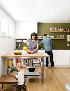 In the kitchen, artist Riley McFerrin installed custom floating shelves.
