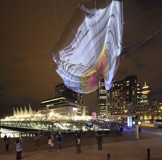 Sculpture Lets the Public Paint the Sky - Photo 2 of 4 - Janet Echelman’s "Skies Painted with Unnumbered Sparks"<br><br>An interactive installation that hung above Vancouver in March, this piece can withstand wind from a Category One hurricane.<br><br>Credit: Ema Peter