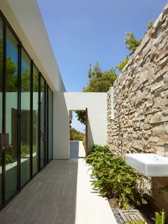 An outdoor sink ties indoor living spaces into outdoor living spaces, adding to the fluidity and openness of the home.