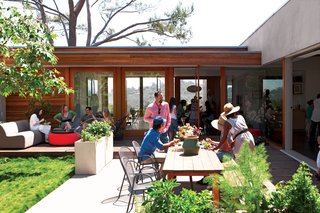 Sliding doors on either side of the living room and along the kitchen open all the way, allowing the breeze from the canyon to spin right through the house.