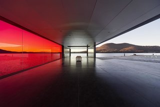 "From the southern approach, you head toward a tunnel; every step tells you that you know what you are going to experience and then suddenly upon arrival, there is an enormous wall of red glass—it seems incomprehensible that you did not know it was there all along," Bailey says.