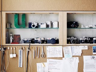 The office houses the letter "U" as well as cameras.