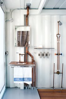 Exposed copper piping adds visual appeal to the guestroom.