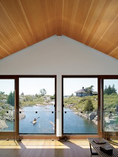 The living room windows overlooking the water let the Worples feel as though they're playing in the water even when they are dry and warm inside.