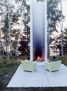 The architect David Salmela's work is often characterized by a bold use of color, but his signature stylistic statement is the chimney—or, as he would have it, the "unchimney." As he explains, "Some years back, I visited a state park in the Copper Harbor area of Michigan, where there was a fort. Most of the log cabins had burnt down, and only the chimneys were left, but they struck me as being very dynamic." And so the unchimney—really an outdoor fireplace—was born. These structures are not real chimneys, Salmela explains. For one thing, they don’t have a flue, but there is a grate, and one can build a fire. "The flames leave a sooty residue on the masonry," he says, "and the next time you see the soot, it triggers a memory of warmth."
