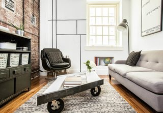 James Davison and his wife, Fanny Abbes, left lucrative careers in finance to start a company, the New Project Group, that rents out designed, furnished apartments in New York City. A parallelogram-shaped window pane, rescued from an architectural salvage yard, was outfitted with steel edges and casters, and repurposed as a coffee table.