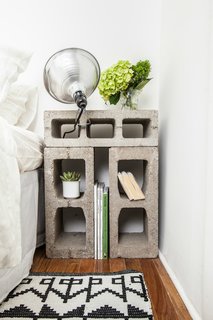 The nightstands were fashioned from concrete blocks that were rescued from the street outside the building. Photo by Alan Gastelum.