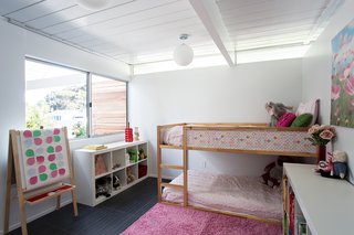 A girl’s bedroom features a ceiling with wainscoting—an impactful way to enhance the space. Photo by Mariko Reed.