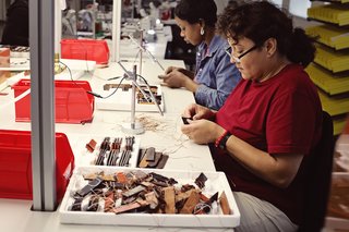 Shinola Expands its Detroit Manufacturing Space - Photo 4 of 6 - A single watch band passes through the hands of nearly a dozen people during the manufacturing process.