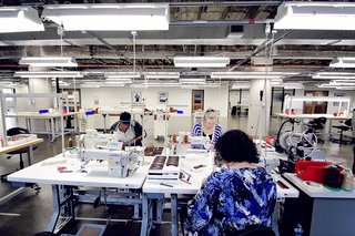Shinola Expands its Detroit Manufacturing Space - Photo 5 of 6 - Producing a watch band is a multi-step process. Leather is brought into the factory, slimmed down in a process called skiving, then layered together, cut into shape, heat-pressed together, then stitched. The last piece is attaching the watch face to the band.
