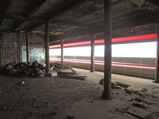 Beneath the Streets<br><br>A train passes through an abandoned station in the New York City subway. Photo courtesy Jurne.