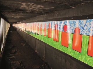 Masstransiscope—a 228-panel installation by artist Bill Brand—can be viewed from trains headed towards the Manhattan Bridge. It was installed in 1980 and sanctioned by the MTA. Photo courtesy Jurne