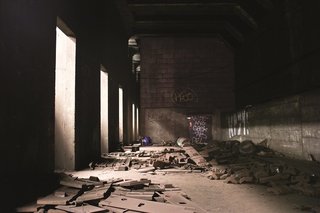 Bright train headlights make their way through the pillars that separate sets of tracks. Photo courtesy Jurne.