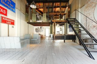 Designer Oasis in Kuala Lampur (Kuala Lampur, Malaysia) <br><br>One of a series of retreats designed by Malaysian architect Ng Sek San, this two-bedroom space is as ethereal and spacious as the mosquito netting hanging from above the beds. San’s design creates myriad environments within the space from the reserved garden to the multi-textured living space and calming bedrooms. <br><br>Listing at Family Guesthouse for 8 in KL City