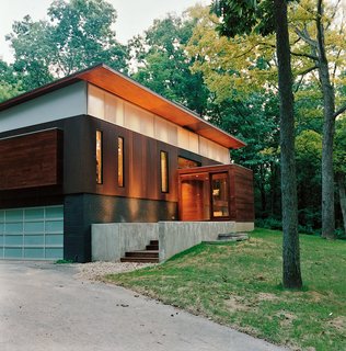 Opened House - Photo 2 of 7 - Designed to be a welcoming space for visitors, the glassy foyer addition is clearly defined against the more private interior of the house.