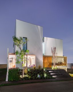The facade at dusk. Photo courtesy of JSa.