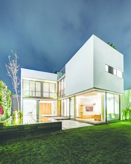 The rear of the house as seen at dusk. Photo courtesy of JSa.
