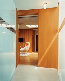 This Surfer's Beach House is More Than It Seems - Photo 10 of 13 - Lloyd-Butler’s second-floor office in the old house, which connects to the addition via the frosted-glass bridge.