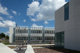 Iowa Utilities Board, Office of the Consumer Advocate (Des Moines, Iowa: 2011)<br><br>There are apt metaphors to be made about this government office building, erected on the site of a former landfill, yet built in such a way that nearly 90 percent of construction waste was recycled. Designed by BNIM architects, the structure’s two wings were made from white Thermomass precast concrete, and gaps that might lower energy efficiency were meticulously removed. The result is a sleek profile that achieves a 75 percent reduction in energy usage compared to a similar code-compliant building.<br><br>Photo by BNIM