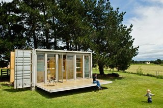 How to Buy a Shipping Container - Photo 3 of 12 - A small shipping container home in New Plymouth, New Zealand features a retractable porch.