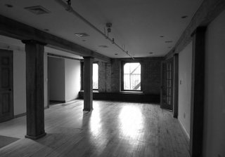 This Cozy Home Totally Changes How We Think of Tribeca Lofts - Photo 2 of 9 - A before shot of the living/dining room.