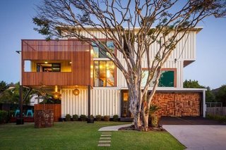 12 Shipping Container Homes That Challenge the Meaning of Shelter - Photo 9 of 12 - Architect and designer Todd Miller didn’t just use a shipping container for this home. He actually used an entire shipping company, since it took 31 containers to build this industrial home, which features a massive graffiti mural on the back wall.