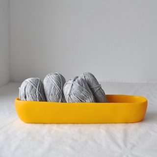 San Francisco designer Tina Frey creates modern resin products for the home, using a thoroughly executed design, hand sculpting, and hand casting process. Her products are all food-safe, making them an excellent serveware solution in the modern kitchen. The Short Trough is a standout container that can be used to hold and display fruit, or as a vessel for an artful centerpiece.