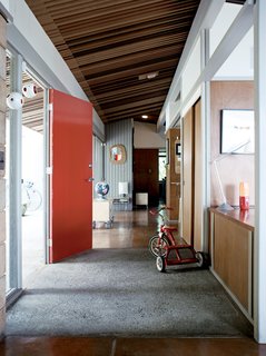 The Pfeiffers' furnishings tend to be of two stripes: flea-market treasures or prototypes and castoffs of Eric's design process. The low tables behind the front door are of Eric's design.