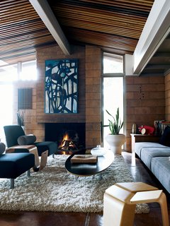 The chairs and end table in the living room are of Eric’s design.
