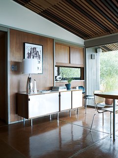 The sideboard in the dining room is by Florence Knoll.