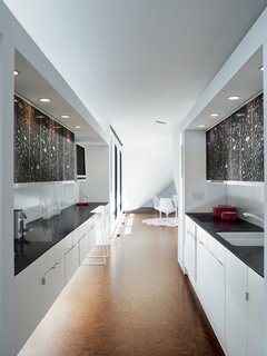 The kitchen is a long sleek space.
