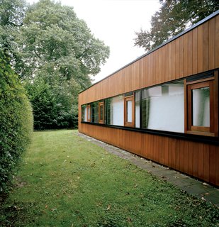 The Tree of Ghent - Photo 5 of 11 - Only the rear of the house suggests the building’s earlier incarnation as a 1960s bungalow, and even here the original brickwork is obscured by wood cladding.
