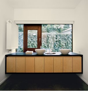 The Tree of Ghent - Photo 6 of 11 - The bathroom mirrors the same materials, colors, and design principles as the rest of the building.