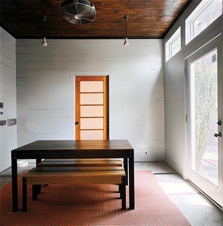 Dollahite kept most rooms spare, allowing each piece of furniture and art to have a presence. In the dining room, the table is its own centerpiece.