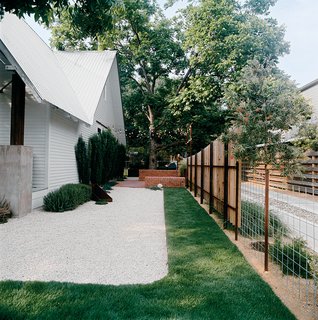 Patches of sod amid white gravel keep water needs low.