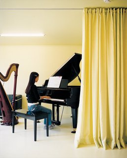 Magic Mountain - Photo 8 of 12 - Musical accompaniment to daily life is provided by the children, both of whom play the grand piano.