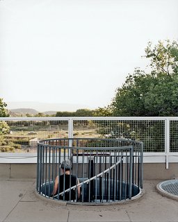 Brigitte descends one of two locally fabricated steel cylinders: her "stairway to the stars."