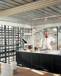 iT House, Joshua Tree - Photo 6 of 9 - All kitchen appliances, cupboards, and counters have been united in a single, self-contained island, designed in collaboration with Bulthaup. The architects wanted unfussy space and they rejected easy-access overhanging cabinets. "There's an emphasis on convenience in the world that is all about numbing things," says Alan Koch.