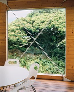Lava Flow 4, The Big Island - Photo 5 of 9 - A huge window next to the dining area is punctuated by a steel X form.