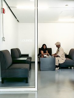 Resident Ernest Gladney speaks with a friend in the Schiff’s lobby area. Site of many a domino match, the tastefully decorated room helps to personalize the Schiff.
