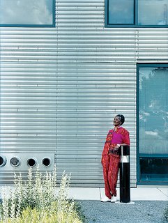 The building’s stark but well-windowed exterior is clad with ridged sheets of stainless steel. Dorothy Barry steps outside for a breath of fresh air.