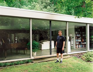 Marcel Breuer Hooper House II - Photo 3 of 9 - North stands outside his glass-walled living room, which also houses his small library of books about Breuer.