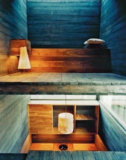 From the sitting room you can see into the bedroom, with its strip of window in the ceiling. From the kitchen table you have a view of the bathroom and the lofted living space above. "You can see the stairs from your bed," Rintala says.