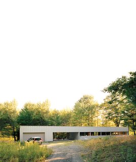 Industrial Revolution - Photo 1 of 7 - This steel-and-glass house, set amid dense forest south of Ithaca, New York, captivated Maria Cook and Lance Compa when they first toured it in 2004. They bought it not long afterward and turned it into a weekend retreat.