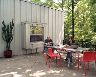 Industrial Revolution - Photo 2 of 7 - Compa and Cook relax on a patio at the western end of the house that overlooks a neighboring farm.