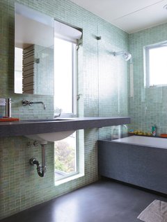 What's the Best Way to Save Space in a Small Bathroom? - Photo 11 of 14 - The vertical full-length window offers a slice of the outdoors in the custom-outfitted master bathroom (save for a tub and sink by Kohler; faucet and showerhead by Vola).