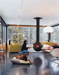 Ski Lift - Photo 3 of 6 - To avoid a space-hogging fireplace, Johnson recommended a Bathyscafocus by Focus Creations. Hiller took the suggestion and now enjoys the warmth of a fireplace and the full square footage of her living room.