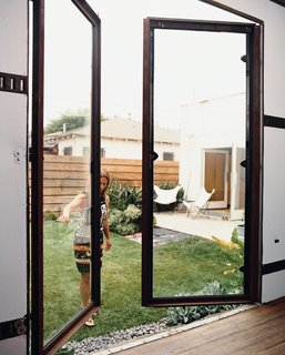 The first phase of rehabbing the backyard trailer was fabricating custom steel-and-glass doors.